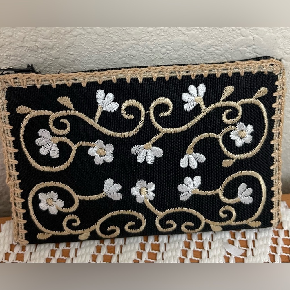 Embroidered cloth card case. Zipper closure.